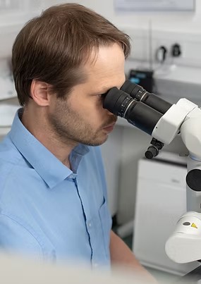 Dr John Barclay working at the dental operating microscope during root canal treatment